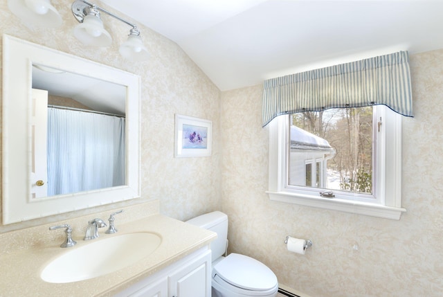 full bathroom with toilet, wallpapered walls, vaulted ceiling, and vanity