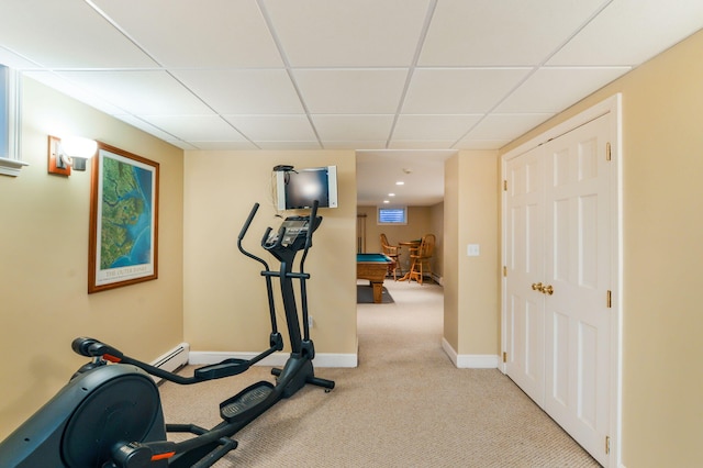 exercise room featuring pool table, baseboards, a drop ceiling, and light colored carpet