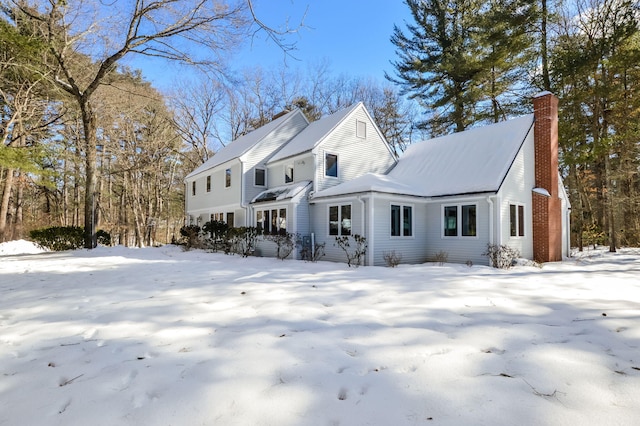 view of front of home featuring a chimney