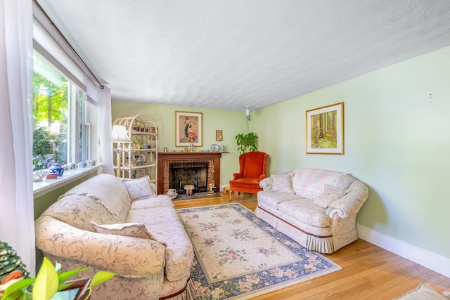 19 Anthony Rd, West Yarmouth, MA 02673 - living room featuring wood finished floors, baseboards, and a fireplace