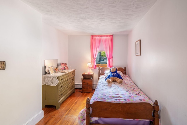 19 Anthony Rd, West Yarmouth, MA 02673 - bedroom with light wood finished floors and a textured ceiling