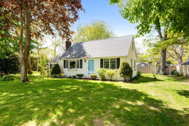 19 Anthony Rd, West Yarmouth, MA 02673 - cape cod-style house with a chimney, a storage shed, a shingled roof, and an outbuilding