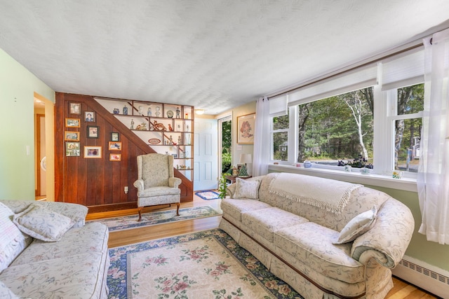 19 Anthony Rd, West Yarmouth, MA 02673 - living room featuring a baseboard radiator and wood finished floors