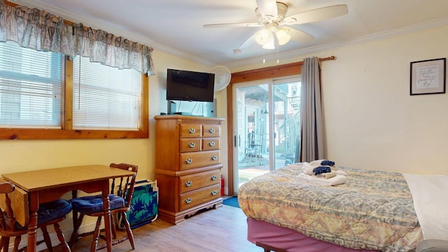 bedroom with light wood-style floors, access to exterior, a ceiling fan, and ornamental molding