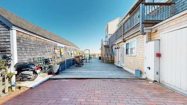 view of patio / terrace featuring stairway and a deck