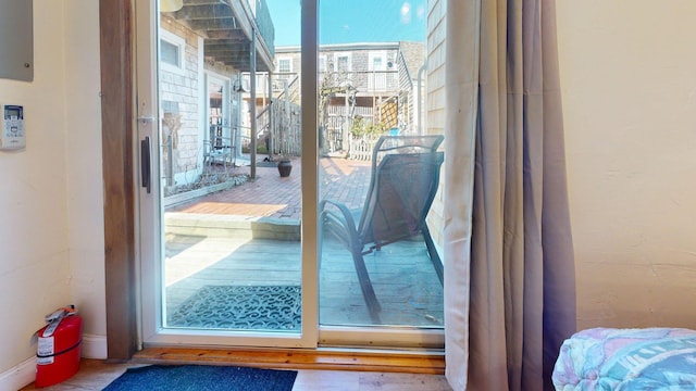 doorway to outside with baseboards