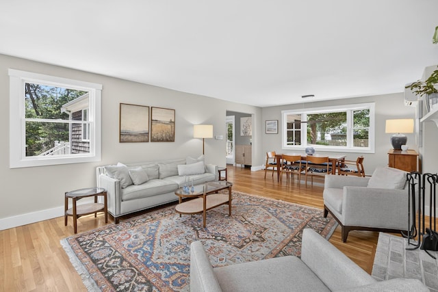 44 Squirrel, Eastham, MA 02642 - living area with healthy amount of natural light and light wood finished floors