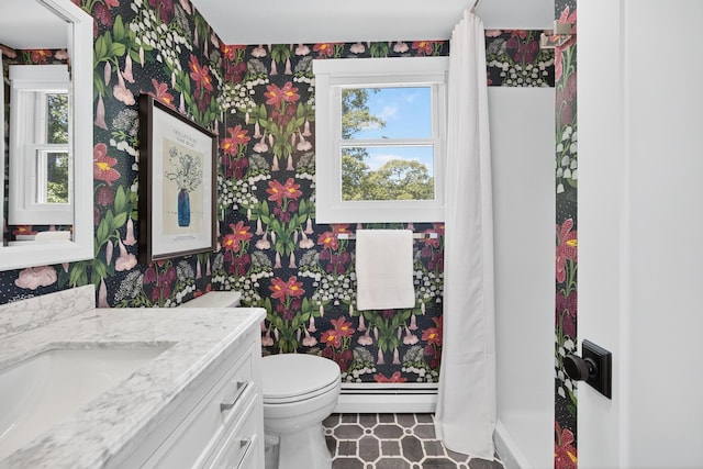 44 Squirrel, Eastham, MA 02642 - bathroom with wallpapered walls, vanity, healthy amount of natural light, a baseboard heating unit, and a shower with shower curtain