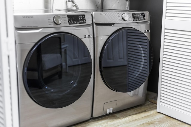 44 Squirrel, Eastham, MA 02642 - washroom with washer and clothes dryer and wood finished floors