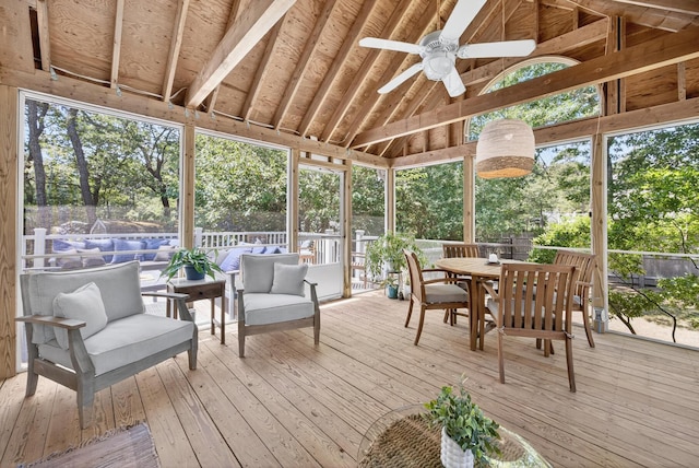 44 Squirrel, Eastham, MA 02642 - sunroom / solarium with a ceiling fan, an outdoor hangout area, outdoor dining space, vaulted ceiling, and view of wooded area