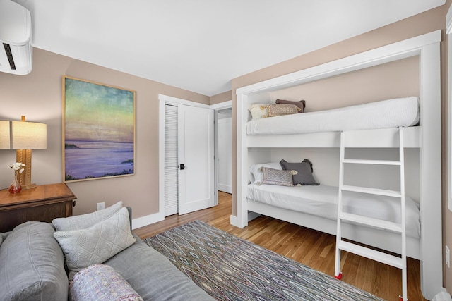 44 Squirrel, Eastham, MA 02642 - bedroom with wood finished floors and an AC wall unit