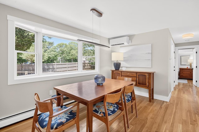 44 Squirrel, Eastham, MA 02642 - dining area with light wood-type flooring and a wall mounted AC