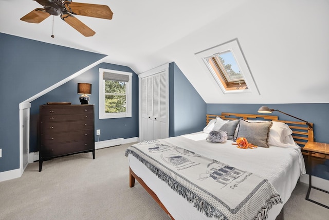 44 Squirrel, Eastham, MA 02642 - carpeted bedroom with a skylight, a baseboard radiator, vaulted ceiling, a ceiling fan, and a closet