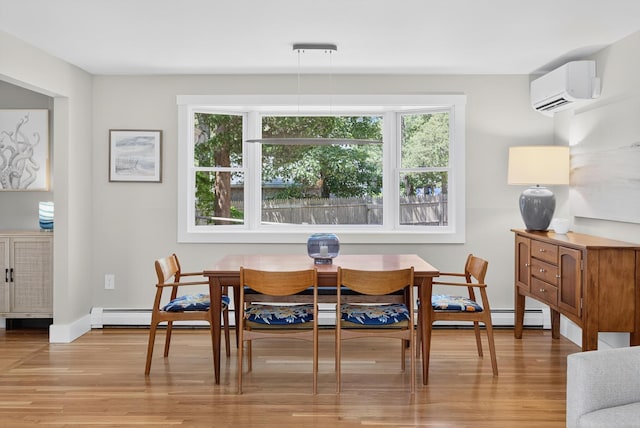 44 Squirrel, Eastham, MA 02642 - dining area with light wood-style flooring and a wall mounted air conditioner