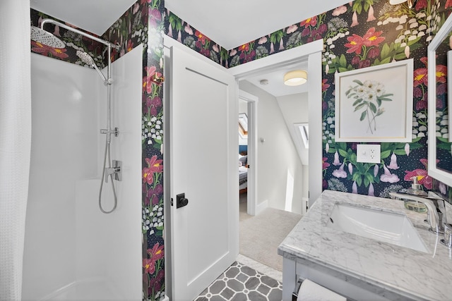 44 Squirrel, Eastham, MA 02642 - bathroom with a walk in shower, vanity, and wallpapered walls