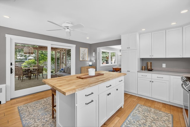 44 Squirrel, Eastham, MA 02642 - kitchen featuring ceiling fan, light wood-type flooring, white cabinets, wooden counters, and recessed lighting
