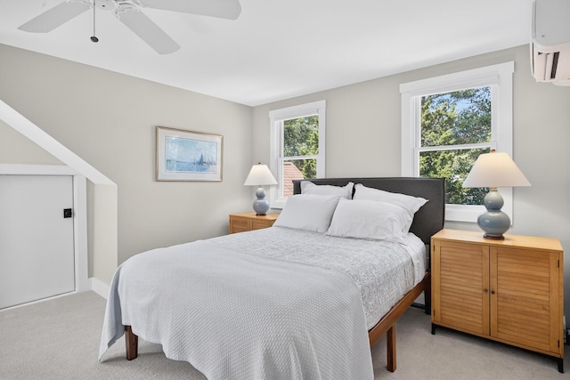 44 Squirrel, Eastham, MA 02642 - bedroom featuring light colored carpet, a wall unit AC, and ceiling fan