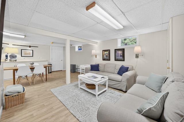 44 Squirrel, Eastham, MA 02642 - living room with a paneled ceiling and light wood-style floors