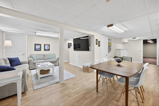 44 Squirrel, Eastham, MA 02642 - living room featuring a drop ceiling and light wood finished floors