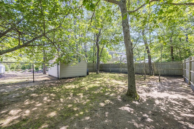 44 Squirrel, Eastham, MA 02642 - fenced backyard featuring a storage shed