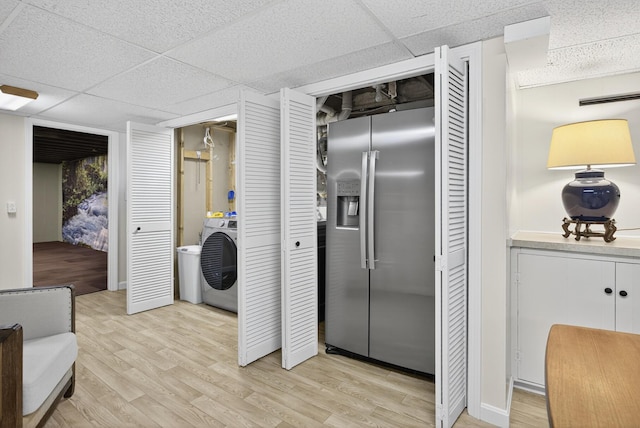 44 Squirrel, Eastham, MA 02642 - kitchen featuring stainless steel fridge with ice dispenser, light wood-type flooring, washer / dryer, and a drop ceiling