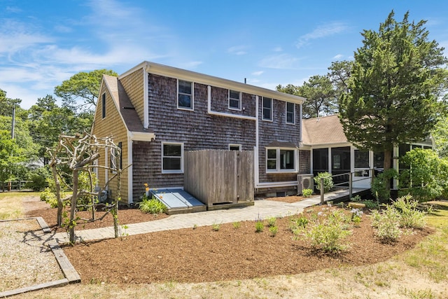 44 Squirrel, Eastham, MA 02642 - rear view of house with a sunroom and a shingled roof
