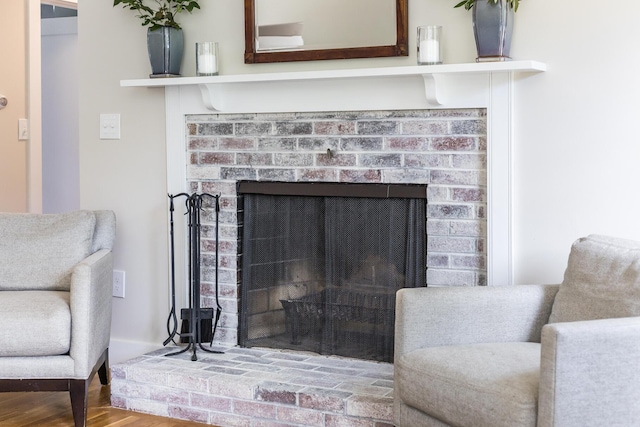 44 Squirrel, Eastham, MA 02642 - detailed view of a brick fireplace and wood finished floors
