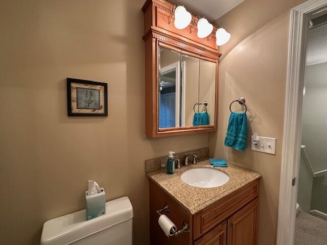 bathroom with toilet and vanity