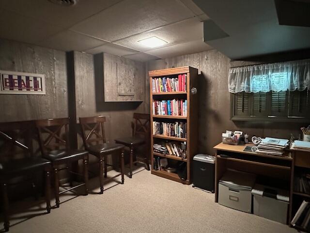 office with a drop ceiling and carpet floors