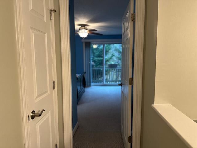 hall featuring carpet