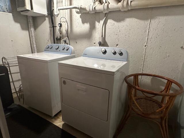 laundry room with washer and dryer and laundry area
