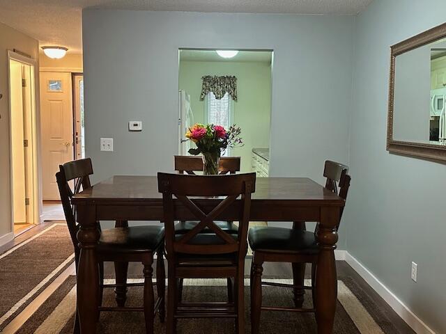 dining room with baseboards