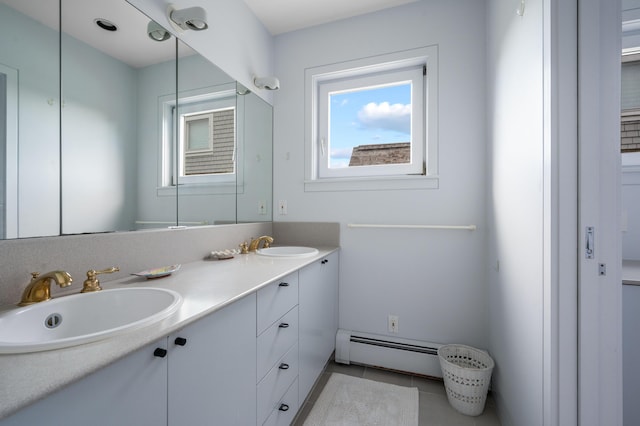 bathroom with vanity, tile patterned floors, and a baseboard radiator