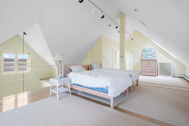 bedroom with light colored carpet, track lighting, and vaulted ceiling