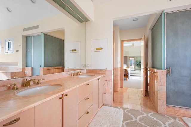 bathroom featuring tile patterned floors and vanity