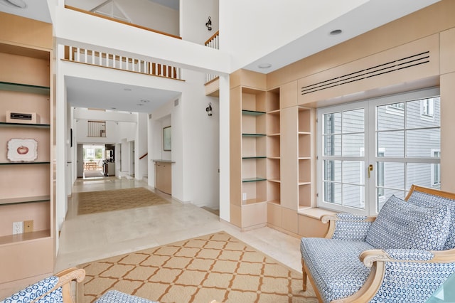 interior space with built in shelves and tile patterned floors