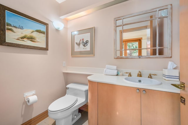 bathroom with vanity and toilet