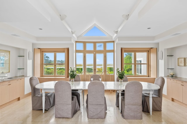 dining area featuring lofted ceiling