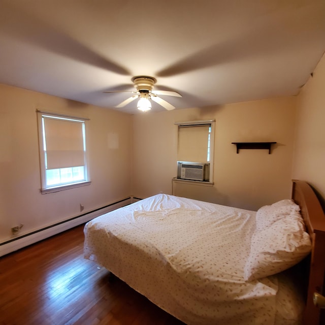 bedroom with dark wood-type flooring, cooling unit, a baseboard heating unit, and ceiling fan