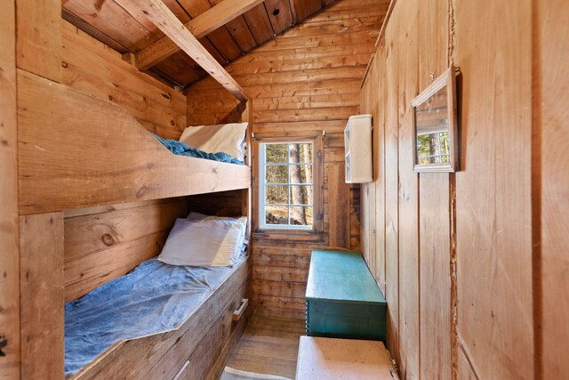 23 Pine Ridge Rd, Buzzards Bay, MA 02532 - bedroom with wooden walls, lofted ceiling with beams, wooden ceiling, and wood finished floors