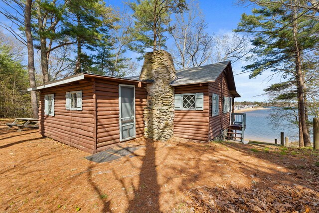 23 Pine Ridge Rd, Buzzards Bay, MA 02532 - view of side of home featuring a water view and a chimney
