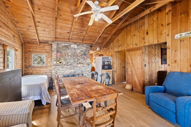 23 Pine Ridge Rd, Buzzards Bay, MA 02532 - dining space with wooden ceiling, wood walls, a ceiling fan, and wood finished floors