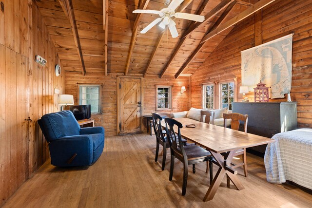 23 Pine Ridge Rd, Buzzards Bay, MA 02532 - dining room featuring hardwood / wood-style flooring, wooden ceiling, wooden walls, a ceiling fan, and vaulted ceiling with beams