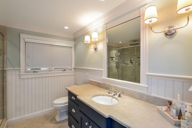 bathroom featuring tile patterned floors, ornamental molding, toilet, a shower with shower door, and vanity