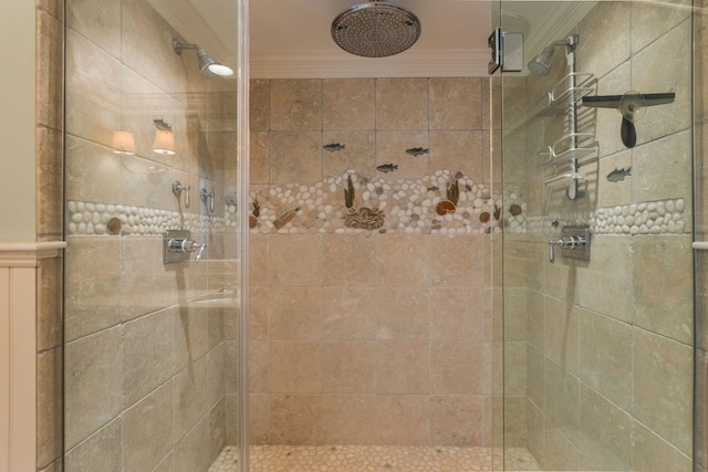 bathroom featuring an enclosed shower and ornamental molding