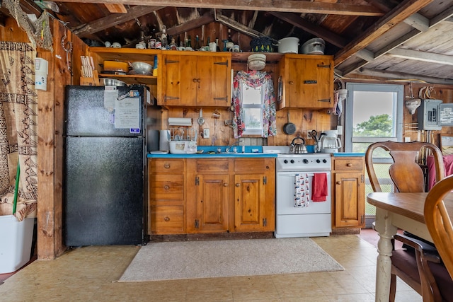 108 Bay View Ave, Edgartown, MA 02539 - kitchen with freestanding refrigerator, white range with electric cooktop, brown cabinets, lofted ceiling, and light floors