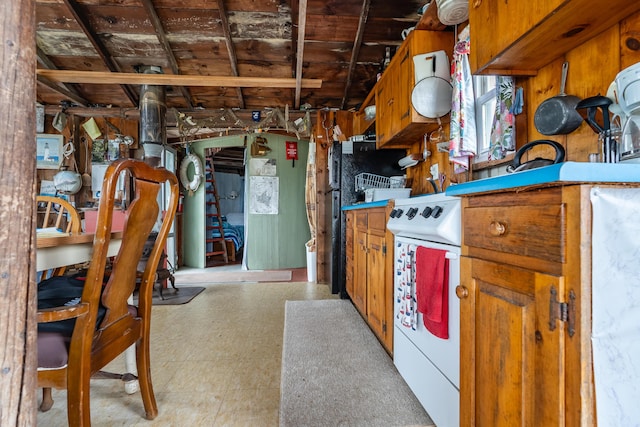 108 Bay View Ave, Edgartown, MA 02539 - kitchen featuring light floors, white electric range, and brown cabinets