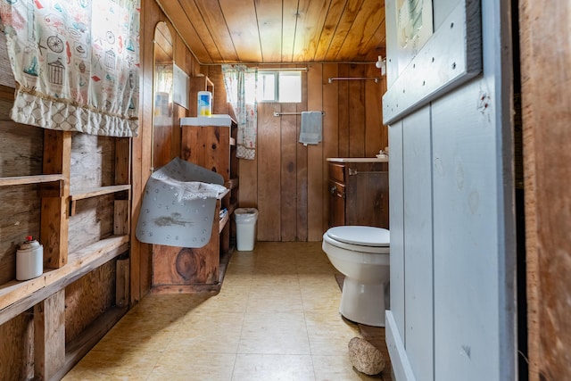 108 Bay View Ave, Edgartown, MA 02539 - bathroom with tile patterned floors, wooden ceiling, and wooden walls