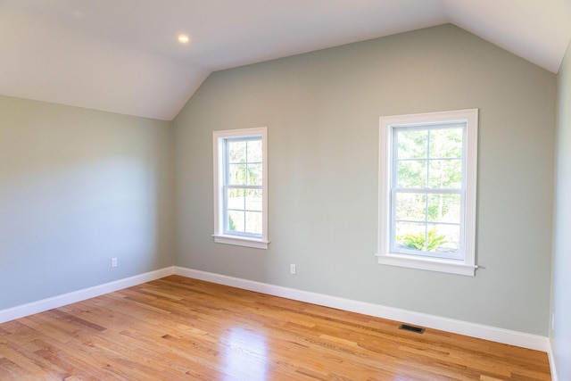 55 Blue Castle Dr, Mashpee, MA 02649 - additional living space with vaulted ceiling, plenty of natural light, light wood-type flooring, and baseboards