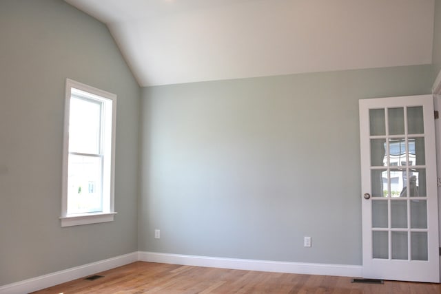 55 Blue Castle Dr, Mashpee, MA 02649 - empty room featuring vaulted ceiling, baseboards, and light wood-type flooring